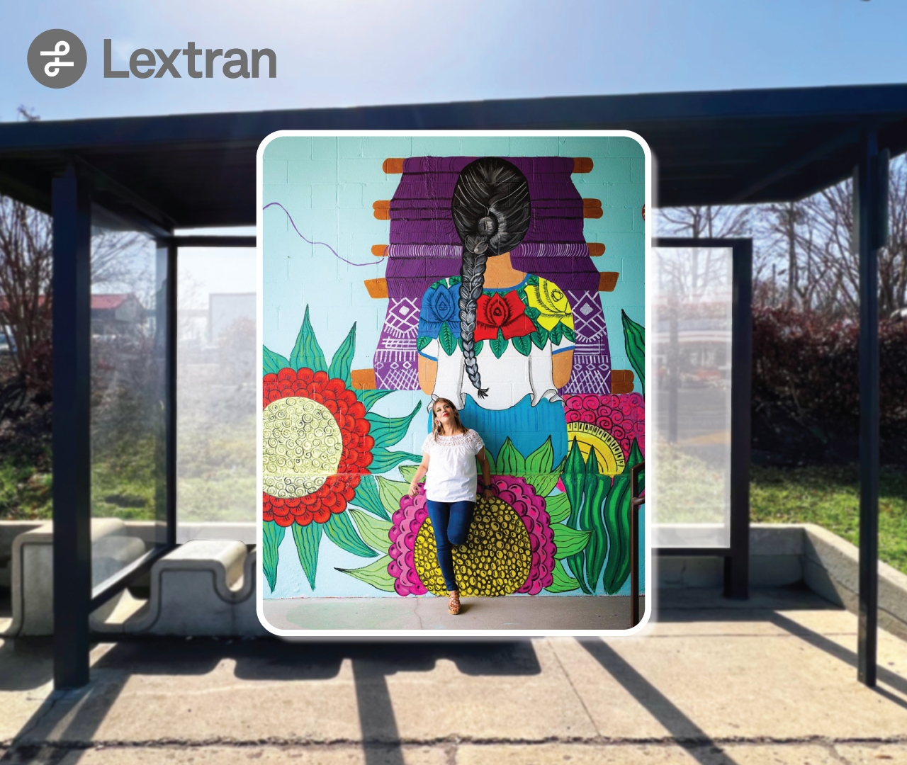 Image of an artist proudly standing in front of their painted mural.
